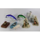 A pair of art glass models depicting swimming Dolphins, together with a set of four Royal
