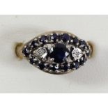 A 9ct gold sapphire and diamond cluster ring, P, 3.2gm