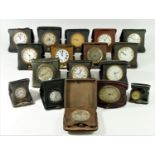 A collection of seventeen 1920s/30s 8 day travelling bedside clocks.