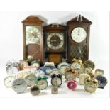 An Edwardian inlaid mahogany banjo barometer together with five wall clocks and a selection of alarm
