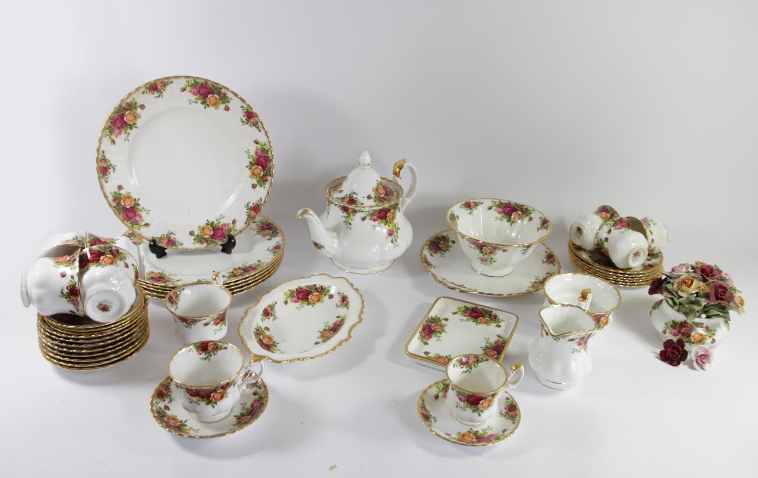 A thirty one piece tea service by Royal Albert 'Country Roses' comprising of teacups & saucers,