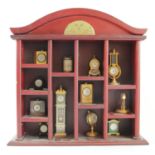 A collection of twelve miniature Gorham clocks, consisting of different styles including,