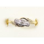 An 18ct gold mounted three stone diamond ring, very thin shank, 2.2gm, N 1/2