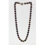 A uniform single row brownish cultured pearl necklace, with paste clasp, 8mm diameter, 41cm