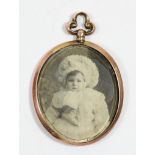 An Edwardian 9ct rose gold double photograph locket/pendant, Birmingham 1905, 42mm, 6gm overall