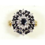 A 9ct gold sapphire and diamond chip cluster ring, N 1/2, 5.7gm