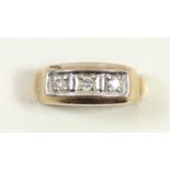 A 9ct gold three stone brilliant cut diamond ring, Q, 2.9gm