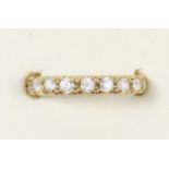 An unmarked gold and white stone full eternity ring, O, 3gm