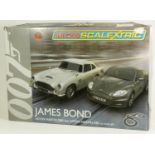 A Scalextric 1:64 scale micro James Bond, Aston martin BD5 and Aston Martin DBS action set, boxed