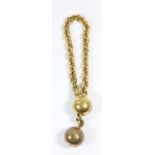 A Victorian gilt metal ball and chain bracelet with locket drop