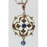 An Edwardian 9ct rose gold and blue paste pendant, period chain, 4.5gm