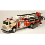 A New Bright remote control fire truck, with extendable ladder and siren
