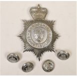 A Shropshire Constabulary helmet badge, Queen's Crown, together with four matching buttons (5)