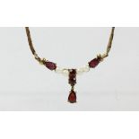 A 9ct gold garnet and cultured pearl necklace, 44cm, 5.4gm.