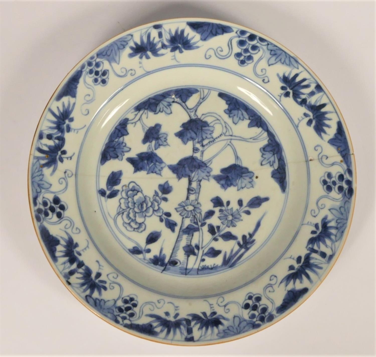 A Chinese Qing blue and white plate with tree decoration, diameter 22.5cm, riveted.