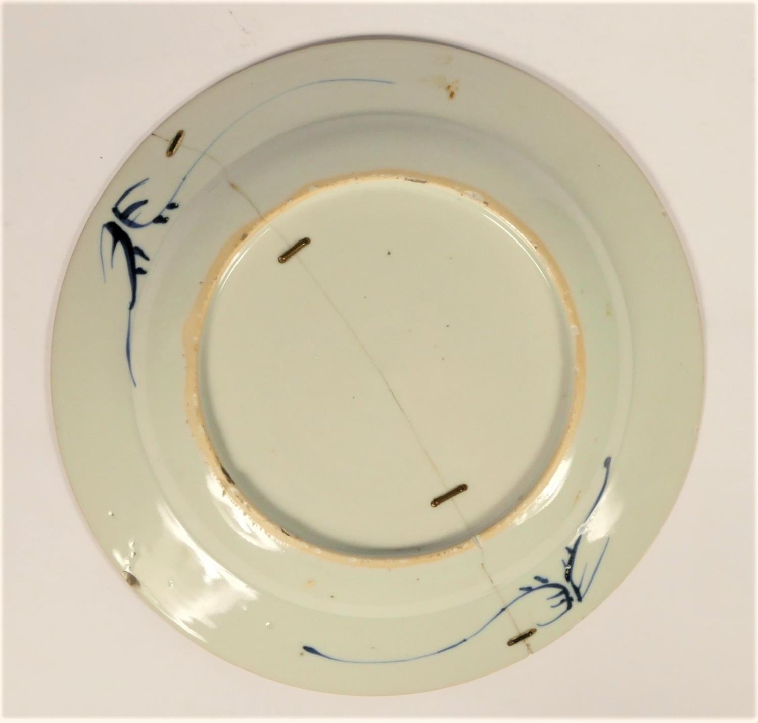 A Chinese Qing blue and white plate with tree decoration, diameter 22.5cm, riveted. - Image 3 of 3