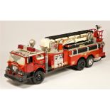 A New Bright remote control fire truck, with extendable ladder and siren