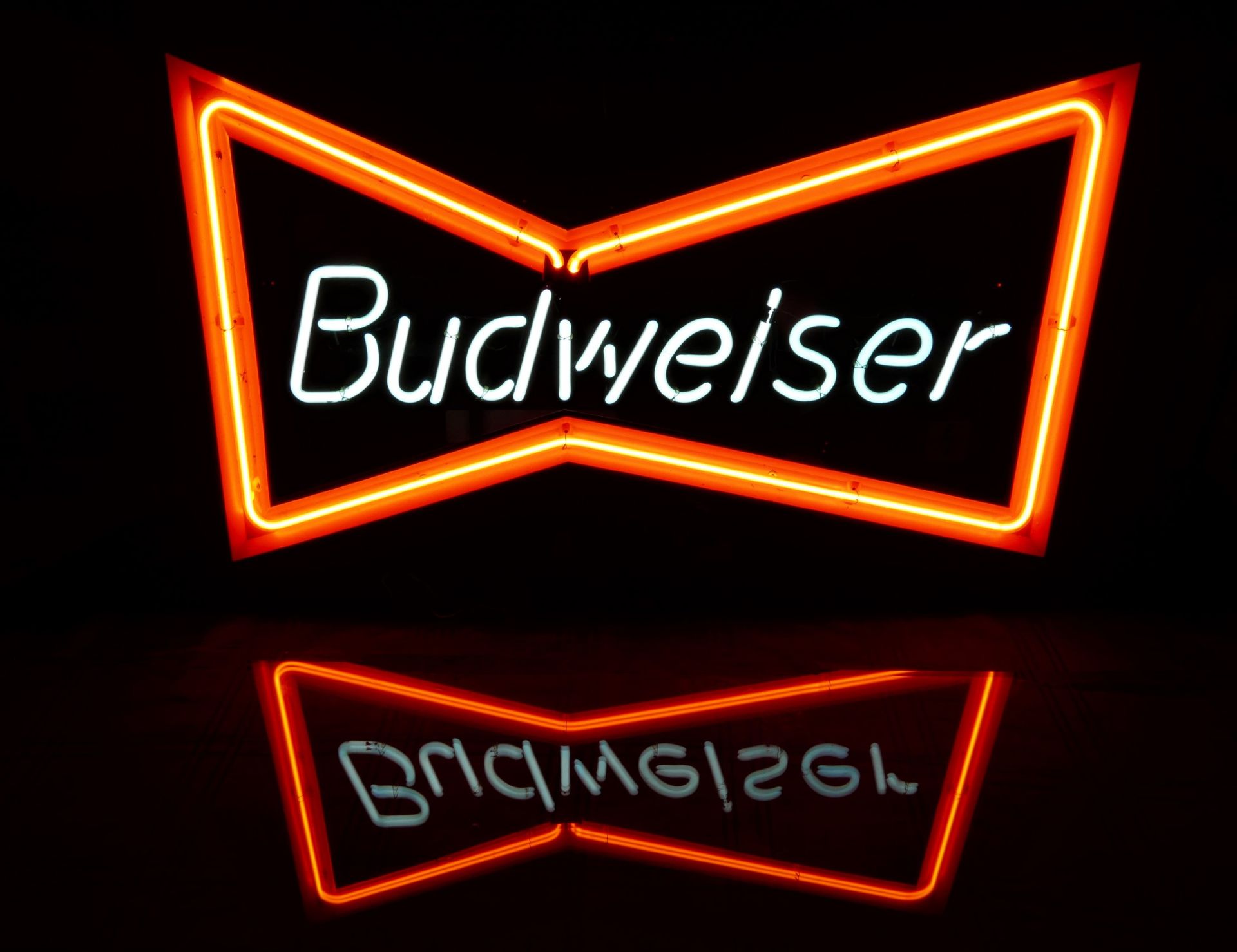 A neon sign, Budweiser, c.1990s, mounted power supply and wall brackets, 72cm x 42cm