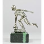 A chrome car mascot in the form of a man on bowling green, mounted on a green marble base, 12cm.