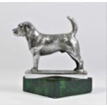 A chrome car mascot in the form of a Beagle mounted on a green onyx base, 9cm.