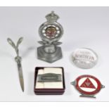 A chrome car mascot in the form of an RAC club badge, together with a Rolls Royce letter opener, a