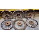 Six various motorcycle wheels.