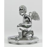 A chrome car mascot in the form of a kneeling winged cherub mounted on a radiator cap, 10cm