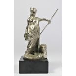 A chrome car mascot in the form of Britannia raised on a black marble base, 17cm.