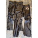 A pair of Skintan lace sided black leather trousers, size 38, unworn, and a pair of Route 69 lace