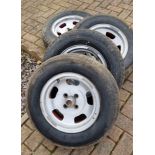 A set of four period Wolfrace Slot wheels, 5 1/2 J X 13, with tyres