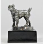 A chrome car mascot in the form of Terrier mounted on a black onyx base, 10cm.