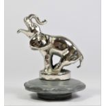 A chrome car mascot in the form of an elephant mounted on a radiator cap, 11cm.