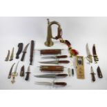 A collection of decorative knives and daggers to include Indian carved wood knife and fork sets,