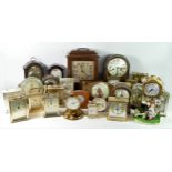 A collection of carriage, travelling, mantle, novelty and anniversary clocks including brands such