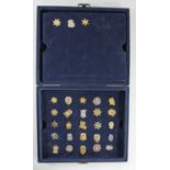 A Mayfair Edition, the Authentic US Police miniature pin badge set (incomplete), fitted interior