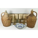 Two large wicker covered demijohns together with a set of four Victorian prints depicting young