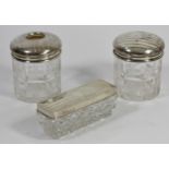 Three silver topped and cut glass dressing table jars, Birmingham 1919, with engraved decoration (3)