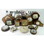 A collection of mantle and wall clocks together with wall mounted barometers to include a French 8