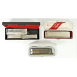 A collection of five harmonica's to include a "Larry Adler" chromatic by M. Hohner (Germany)