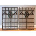 A pair of reclaimed leaded stained glass panels, circa early 20th/late 19th century, with Arts &