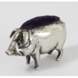 A silver novelty pig pin cushion, apparently unmarked, 4.5cm