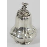A Continental silver guard shape holder, marks defaced, the pull off cover with floral finial,