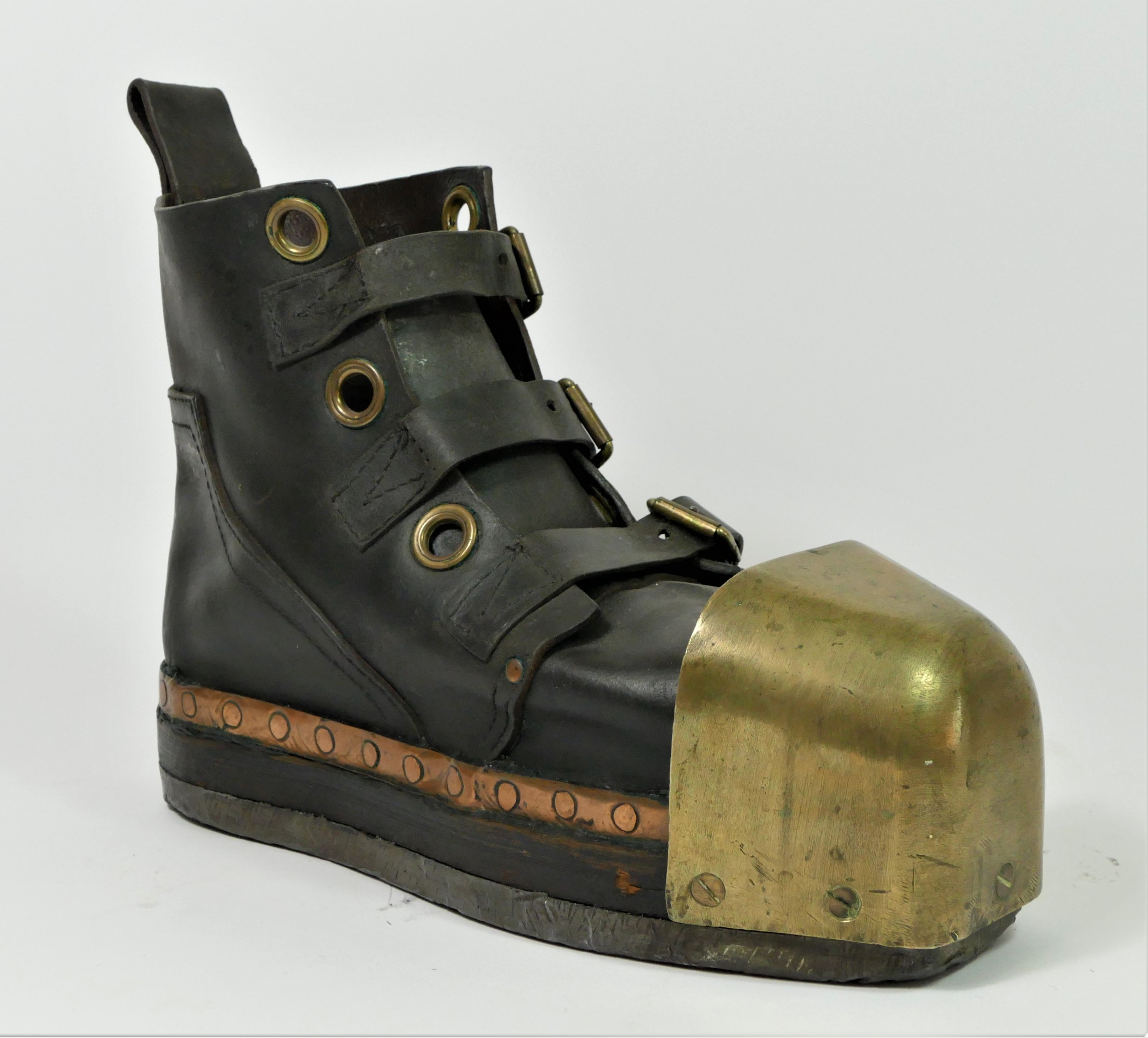 An English deep sea diving boot, c.1920's, leather, brass toe cap and lead sole, length 36cm