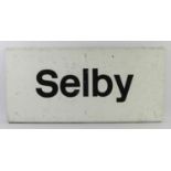 An enamel Selby station sign, 29 x 62cm