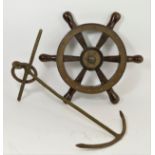 A small hardwood and brass ship's wheel, diameter 46cm and a wrought iron fisherman's anchor,