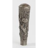 An Indian white metal parasol handle, embossed and chased with tigers, 8.5cm