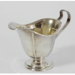 A Sterling Silver milk jug, 13cm across handle, 61gm