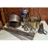 A set of four early 20th Century graduated brass jam pans, together with a set of fireside irons,