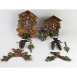 Mid 20th Century Black Forest two train cuckoo clocks, complete with weights & pendulums. (2)