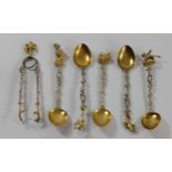 An Italian .800 silver and silver gilt cast set of five spoons and a pair of tongs, 82gm